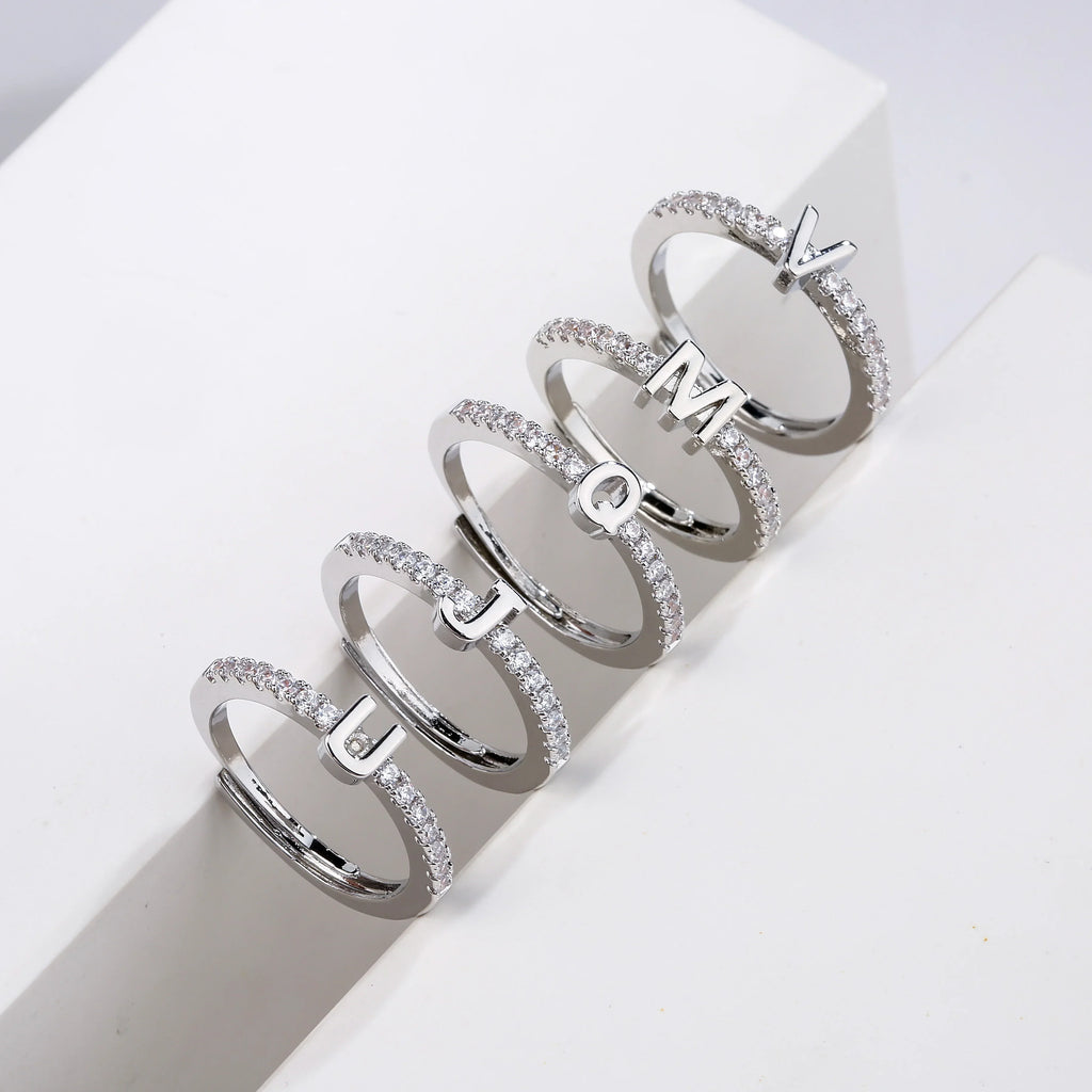 Adjustable women's ring with initial - letter