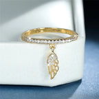 Ring with angel wing pendant gold