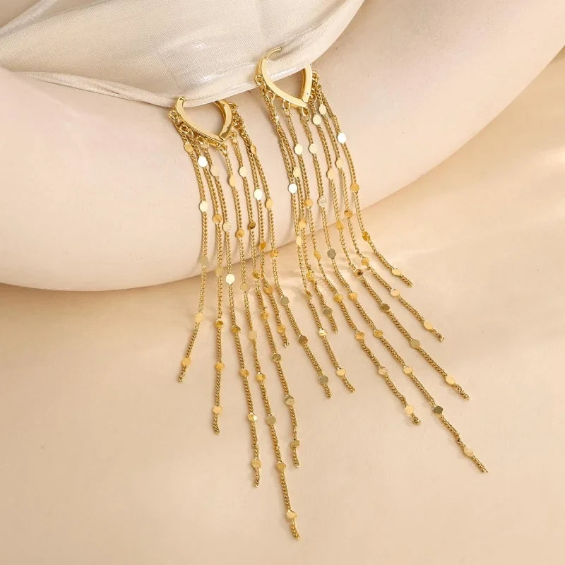 Pompon earrings enhancing the face