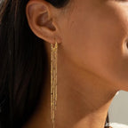 Pompon earrings enhancing the face