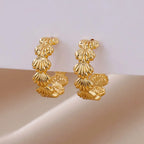 Women's shell earrings in gold