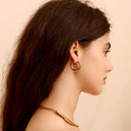 Gold spiral motif hoop earrings
