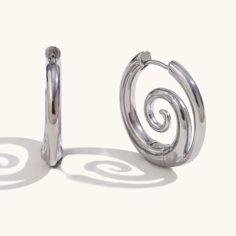 Silver spiral motif hoop earrings