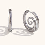 Silver spiral motif hoop earrings