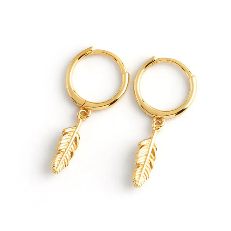 Gold hoop earrings with small dangling feather