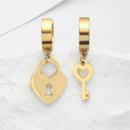 Gold key and padlock hoop earrings