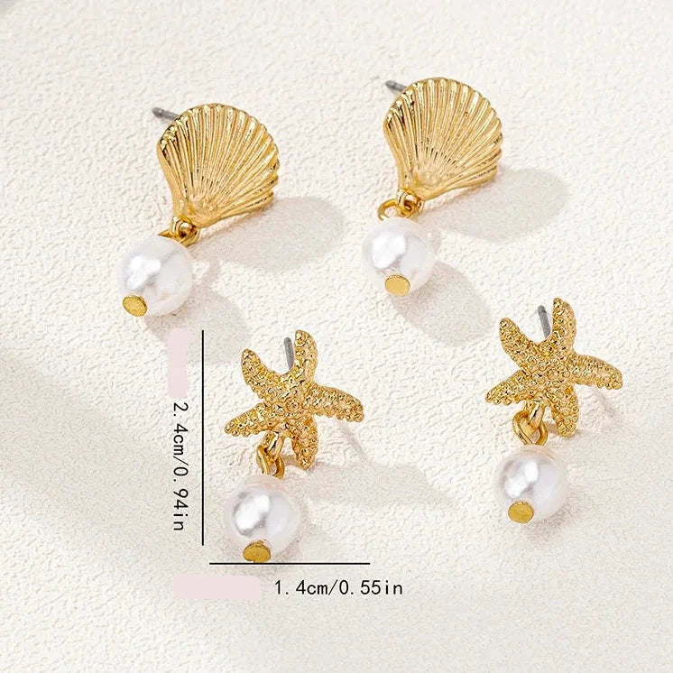 Gold-tone seashell, starfish, and pearl earrings