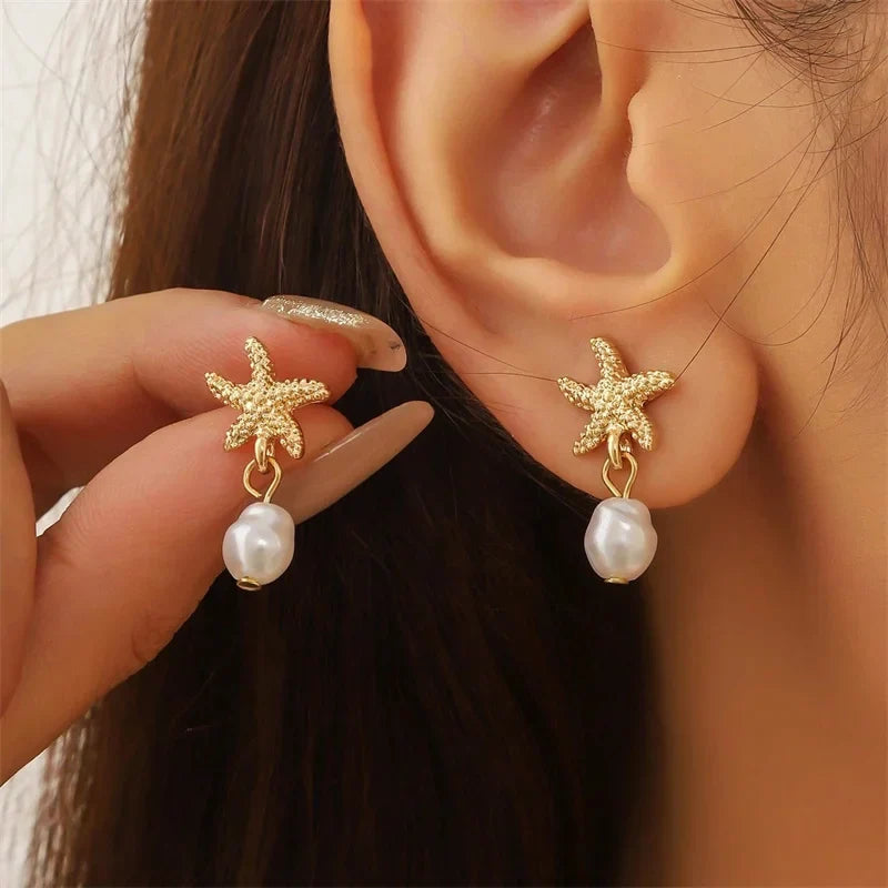 Gold-tone seashell, starfish, and pearl earrings