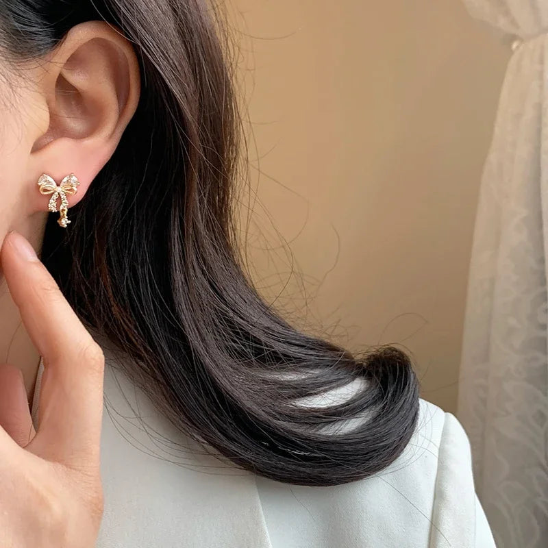 Women's gold bow earrings