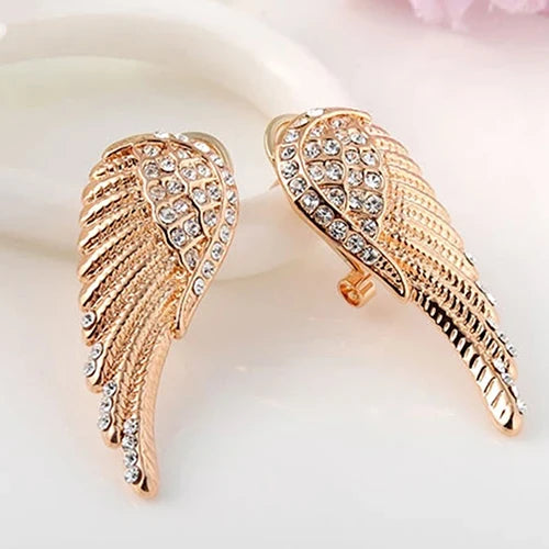 Dangling angel wing earrings with gold rhinestones