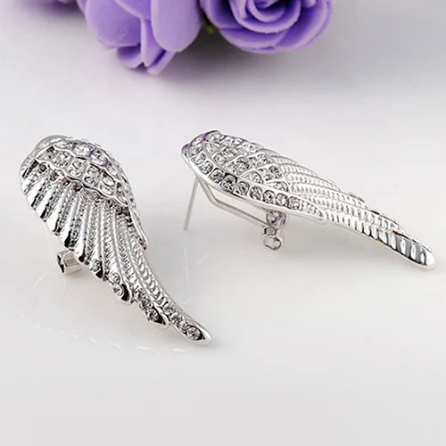 Dangling angel wing earrings with silver rhinestones