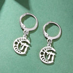 Silver dangling earrings with the Chai symbol of life on a crescent moon