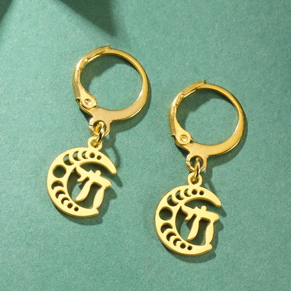 Gold dangling earrings with the Chai symbol of life on a crescent moon