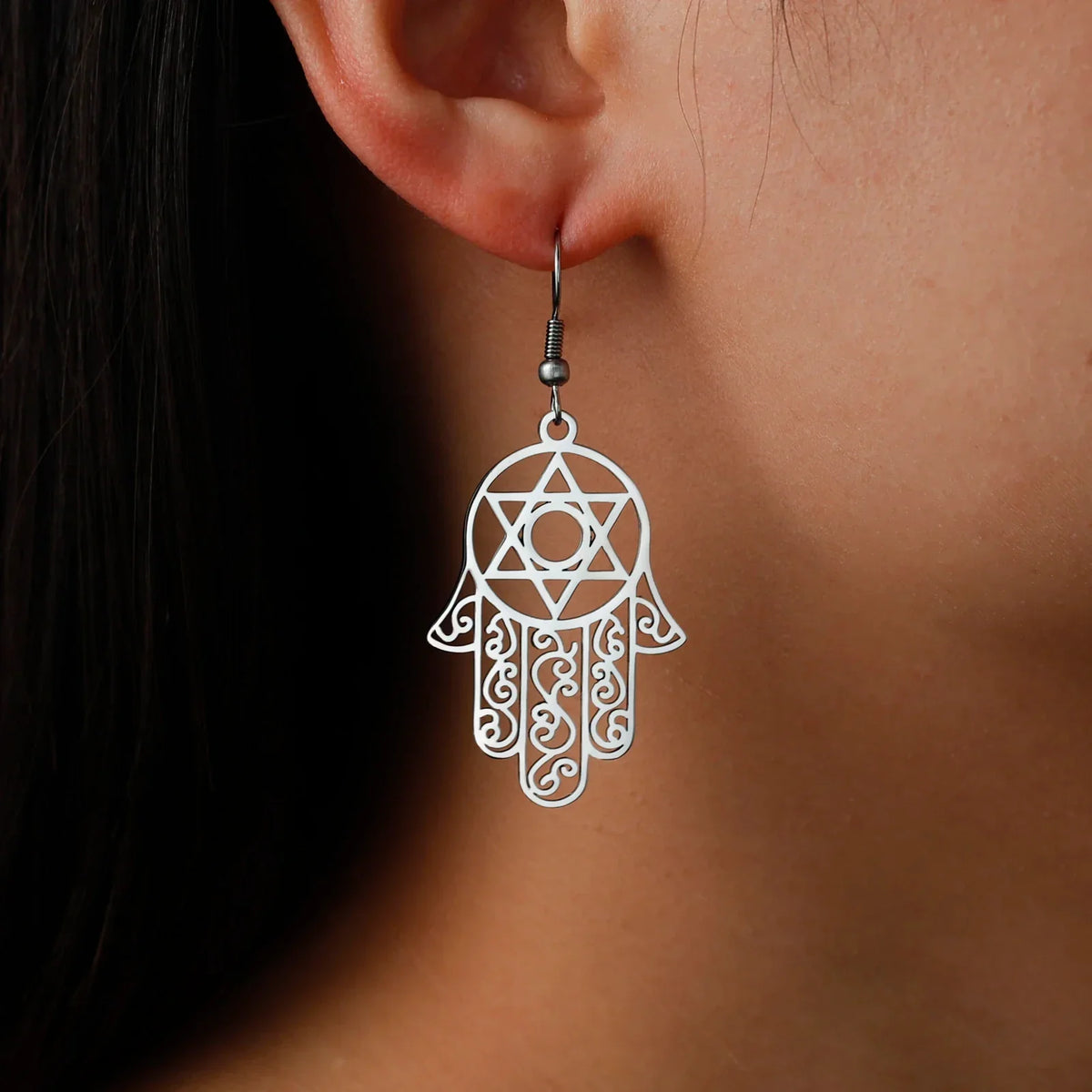 Dangling earrings with the Jewish protective symbol, Hamsa hand and Star of David, silver