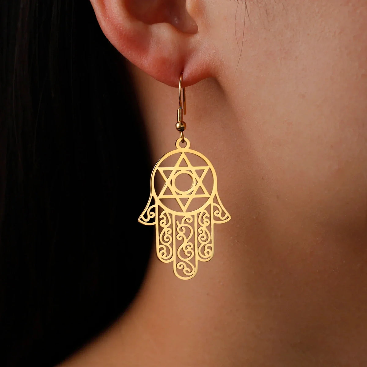 Dangling earrings with the Jewish protective symbol, Hamsa hand and Star of David, gold