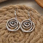 Drop earrings with engraved spiral