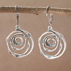 Drop earrings with engraved spiral
