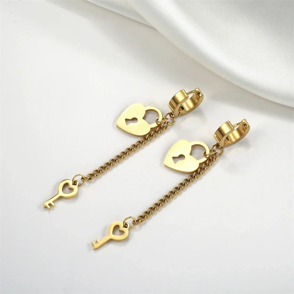 Gold key and lock dangle earrings