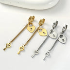 Gold key and lock dangle earrings