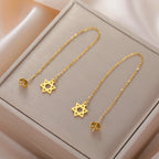 Long dangling earrings with the Star of David Jewish symbol in gold