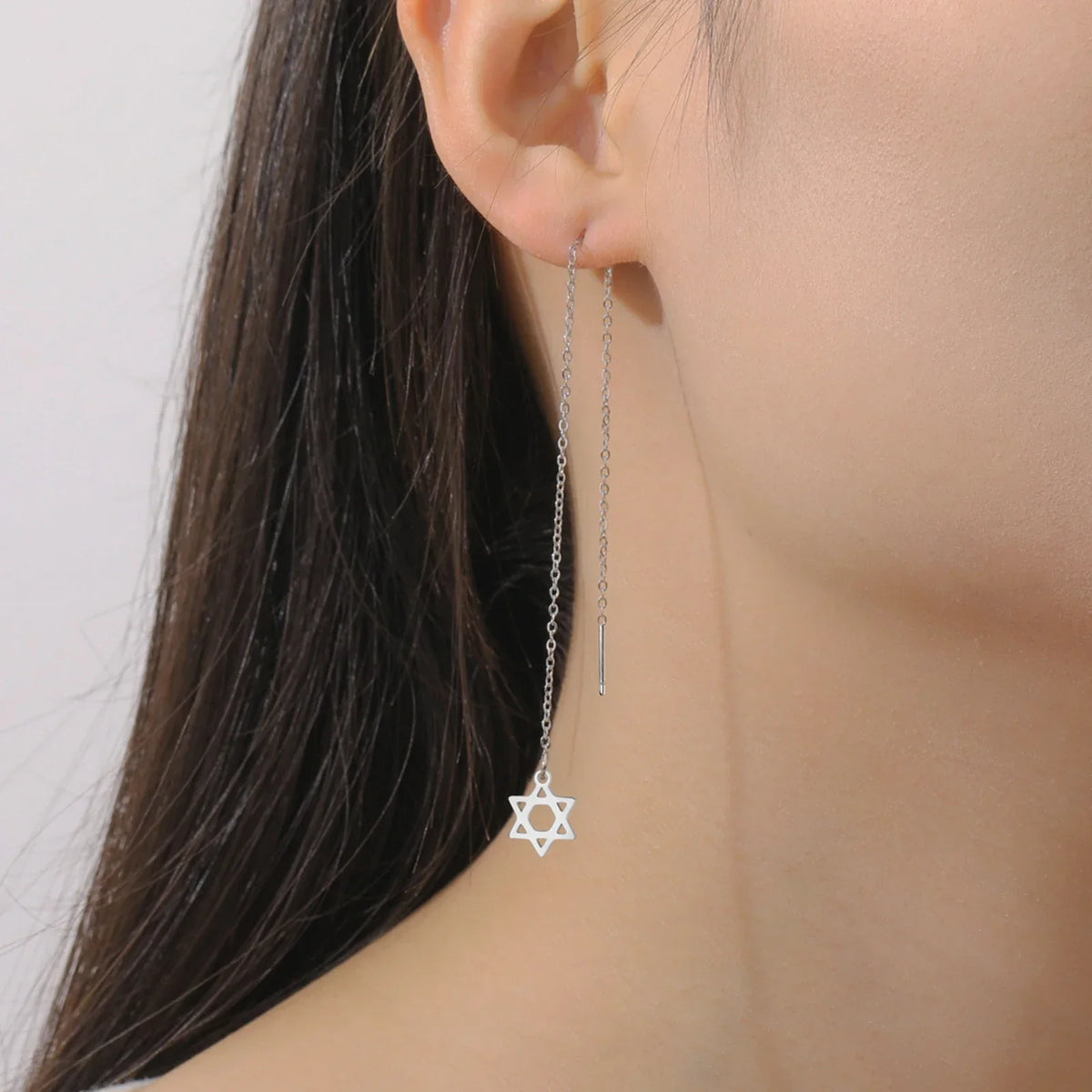 Long dangling earrings with the Star of David Jewish symbol in silver