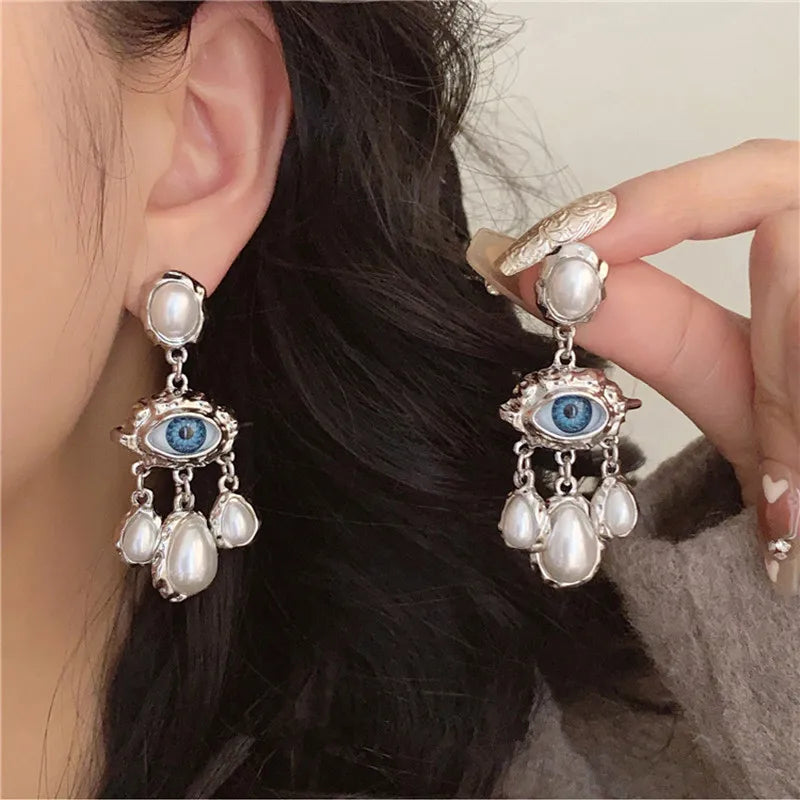 Blue Eye and Pearl Drop Earrings in silver