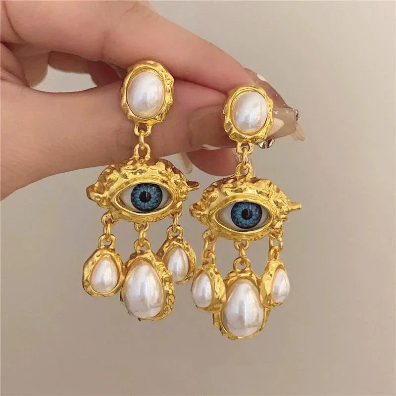 Blue Eye and Pearl Drop Earrings in gold