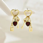 Women's dangling earrings with keys and padlocks