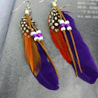 Apache-style feather earrings purple