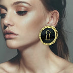 Round black key earrings