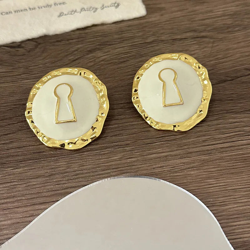 Round white key earrings