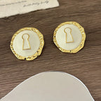 Round white key earrings