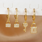 Key and lock hoop earrings with rhinestone key and lock gold