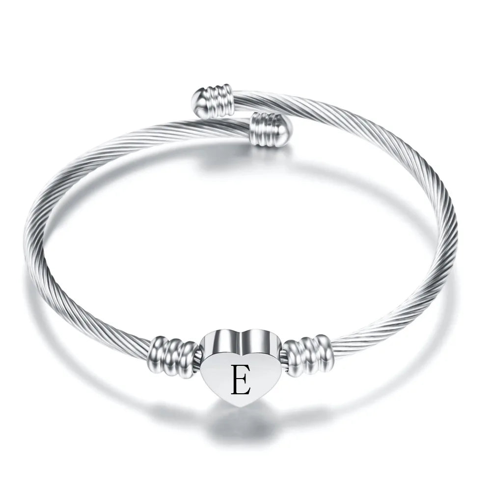 Heart bracelet with silver initial e