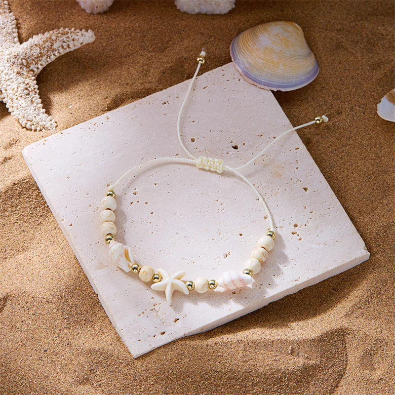 Cord bracelet with shell and white starfish star