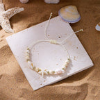 Cord bracelet with shell and white starfish star