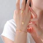 Hand and finger bracelet with Jewish protective pendants Chai, Star of David and Hamsa star gold