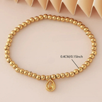 Gold-tone bracelet with birthstone for women