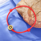 Rope bracelet with the Jewish symbol, the red and gold Star of David