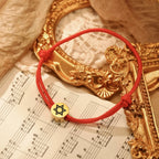 Rope bracelet with the Jewish symbol, the red and gold Star of David
