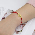 Cord bracelet with Arabic Hand of Fatima in gold
