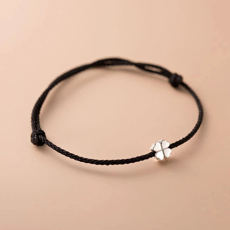 Cord Bracelet with White and Black Four-Leaf Clover
