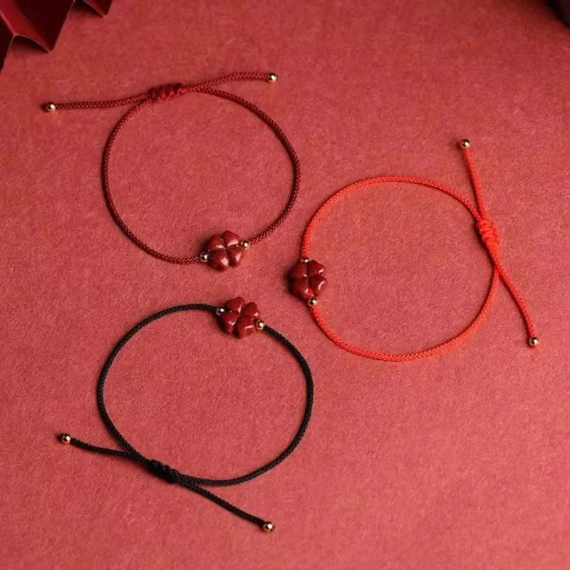 Cord Bracelet with Four-Leaf Clover in Dark Red Cinnabar Stone