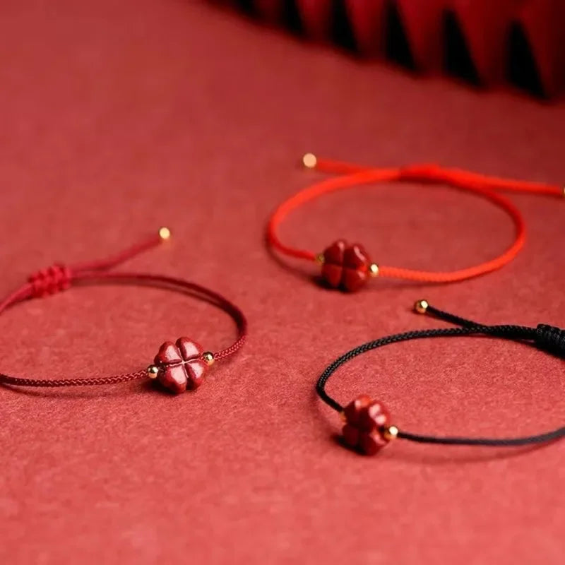 Cord Bracelet with Four-Leaf Clover in Red Cinnabar Stone 