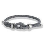 Modern braided cord bracelet with gray knot