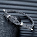 Modern braided cord bracelet with gray knot 