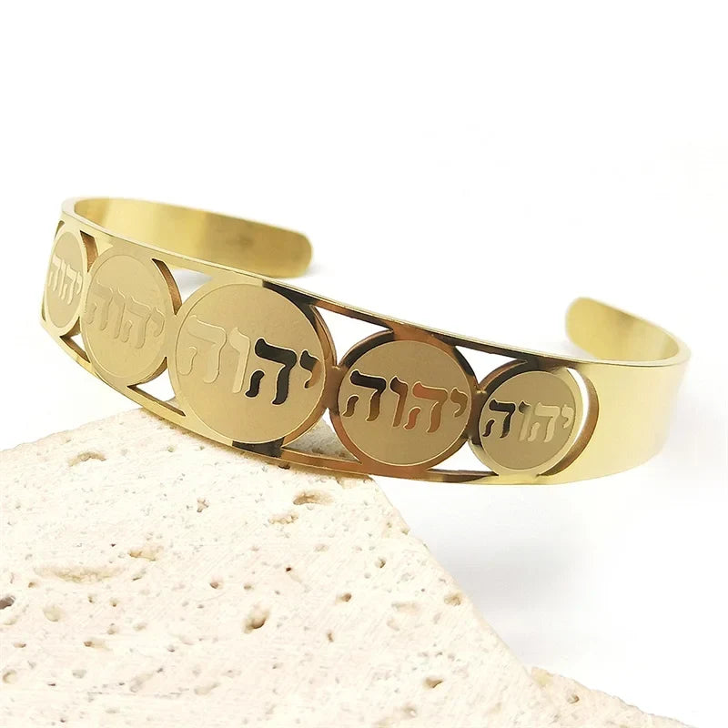 Open cuff bracelet with Hebrew letters in gold