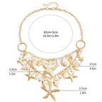 Necklace with large shell and starfish pendant