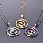 Necklace with large openwork spiral pendant in silver tone