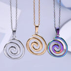 Necklace with large openwork spiral pendant in gold tone